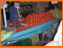 Animated contact sheet showing three distinct scenes: a market stall with tomatoes, four people posing together, and a store interior transaction.