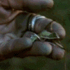 showing a hand holding a leaf, a face with tears, and a figure with a bow, with overlaid text changing from "Not idly do the leaves of Lorien fall..." to "They may yet be alive!"