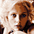 A 48x48 pixel animated contact sheet showing three sequential frames of a celebrity's face with varying expressions and hair movement, displayed on a gray background.