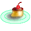 Pixelated dessert icon with light green plate, brown top layer, yellow base, and red cherry on top.