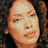 A 3x3 contact sheet of a pixelated animated icon featuring a woman with curly hair, displaying sequential facial expressions and text elements against a black background.