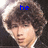 A four- shows a person with curly brown hair and dark clothing, each displaying different blue pixelated text above the head