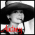 Black-and-white image of a person wearing a wide-brimmed hat with red text 'Audrey' overlaid, featuring animated star symbols in different positions.