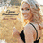 A pixelated image of a woman with curly blonde hair wearing a black sleeveless top, holding a microphone and smiling broadly in two sequential poses.