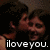 Pixelated image of a person with dark hair and brown skin making an expressive gesture, overlaid with white text reading 'iloveyou.'