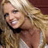Static 48x48 pixel icon showing a close-up of a person with blonde hair and light skin, wearing a dark top against a blurred background.