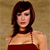 Pixelated image of a person with dark brown hair wearing a dark red strapless top against a light brown background.