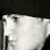 A static image of a white, pixelated, abstract shape against a dark background with visible pixelation and no discernible subjects or text.