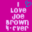 A static pixel art image with a bright pink background displays white text reading "I Love Joe Brown 4-ever" and a cyan heart symbol above the word "Love." The right side of the image is slightly blurred compared to the left.