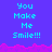 Pixelated text "You Make Me Smile!!!" repeated across a blue background with pink wave-like border.