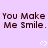 Light purple background with repeated brown text "You Make Me Smile." and white pixelated hearts, partially cropped at bottom right.
