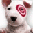 A white dog with a red bullseye on its face appears in a with orange and gray sections containing text