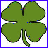 Green four-leaf clover with blue and purple pixel artifacts inside a blue border, next to green text reading "Happy St. Pat's Day!!!" on white background.