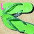 Green cartoon character with blue accents on a beige background, text above changes from 'L' to 'Lin' to 'Linds' then 'Lindsey' in pink letters.