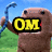 Brown pixelated character with black eyes and red mouth holds blue hook, text changes from OM to NOM across frames.
