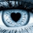 Pixelated close-up of a stylized eye with light blue iris and black heart-shaped pupil, set against dark background.
