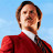 Static pixelated image of a person in red clothing against light blue background with visible dithering and color blending artifacts.