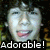 A four- shows a person with curly dark hair in three , each displaying different facial expressions and text overlays