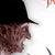 Static 50x50 pixel icon showing partial view of a character's face with black hat and brown hair against white background.
