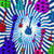 Pixelated abstract composition with scattered colorful shapes including green, purple, red, blue, and pink forms against a blue-and-white checkered background.