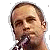 Pixelated image of a person holding a microphone with text 'Jack Johnson' in pixelated font on gray background.