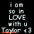 Pixelated text on black background reads 'i am so in LOVE with u Taylor <3' with orange underline beneath 'Taylor <3' in two