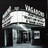 Pixelated grayscale image of a building facade with a prominent sign displaying 'THEATRE' in block letters, set against a dark background.