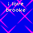 Blue background with pink diamond-shaped lines forming a pattern, overlaid with four identical text blocks reading "i love brooke" in yellow pixelated font