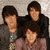 Three people pose together on the left; bright pink text reads 'i love jonas brothers' on the right.