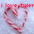 Red candy canes form a heart shape on light blue background with red text above.