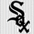 Black stylized 'S' with cross-like base on light gray striped background, pixelated rendering.