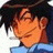 A pixelated anime-style character with dark hair and a blue shirt appears on the left side of a contact sheet, while the right side displays stylized text "Anime IM" above smaller text "com" against a black background.