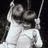 Black background with pixelated grayscale image of two people on a swing, pink text reading "i love you" with heart symbol and additional text below.
