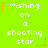 Bright green background with white pixelated text reading "wishing on a shooting star" arranged in a , surrounded by orange and yellow star-shaped pixel decorations