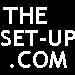 Black background with white pixelated text 'THE SET-UP .COM' on left, right side shows blurred figure in dark clothing holding a small object.