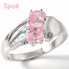 A silver ring with three pink gemstones and one small dark stone, displayed in a with text labels and a heart icon