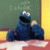 A pixelated contact sheet showing two frames of an animated icon featuring Cookie Monster from Sesame Street next to text reading "C IS FOR COOKIE" on a black background.