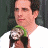 A 48x48 pixel animated buddy icon featuring a character holding a small dog, with text reading "Along Came Polly" in red serif font on the right side of the image.