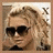 Pixelated static image of a person with light brown hair wearing dark sunglasses, set against a beige background with faint pixelated text on the right.