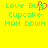 Yellow background with green pixelated text reading "Love Bug Cupcake MAN DOWN" and a red heart symbol replacing the 'o' in "Bug".