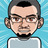 Pixelated avatar of a person with short dark hair, glasses, and a light gray shirt against a blue pixelated background.