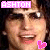 Pixelated close-up of a person with dark hair and light skin, wearing sunglasses, smiling broadly with visible teeth, pink text above head reading 'ASHTON', two pink heart symbols below the face.