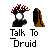 Pixelated icon shows a hand with red-tipped fingers holding a white sphere, next to a brown stone-like shape; text reads 'Talk To Druid' below.