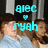 Two people lie side-by-side on a bed with light blue sheets, overlaid by cyan text reading 'blec' above a heart symbol and 'ryah' below it.