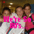 Group of people in a photo with pink text overlays changing across frames.