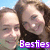 Two people with light skin tones and brown hair pose closely together against a blue sky background, with purple text reading 'Besties' at the bottom.