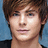 Pixelated portrait of a person with brown hair against blue background, on bright pink field with text 'Zac Efron' and 'Is So Cute'.