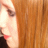 A 2x2 contact sheet of a pixelated animated icon featuring a person with long red hair and red lipstick, displaying text changes across frames.
