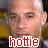 A pixelated image of a person with short hair, showing two side-by-side views where the right view has brighter lighting on the face.