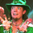 A 48x48 pixel animated buddy icon featuring a character in green attire on the left and text elements on a blue background to the right, displayed as a contact sheet with two frames.